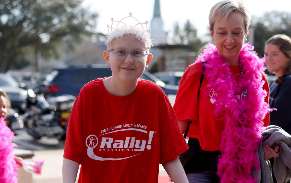 Rally Kid Phoebe in a red Rally shirt at a Rally event