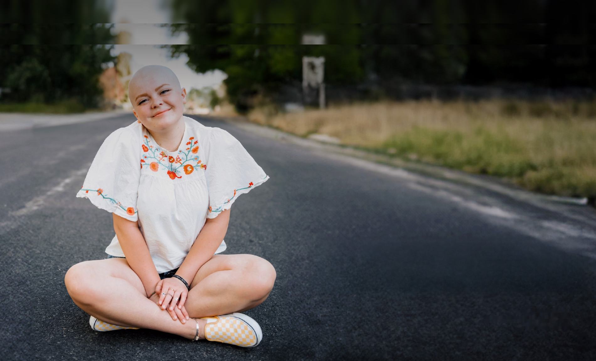 Rally Kid Samantha sitting in the middle of an open road